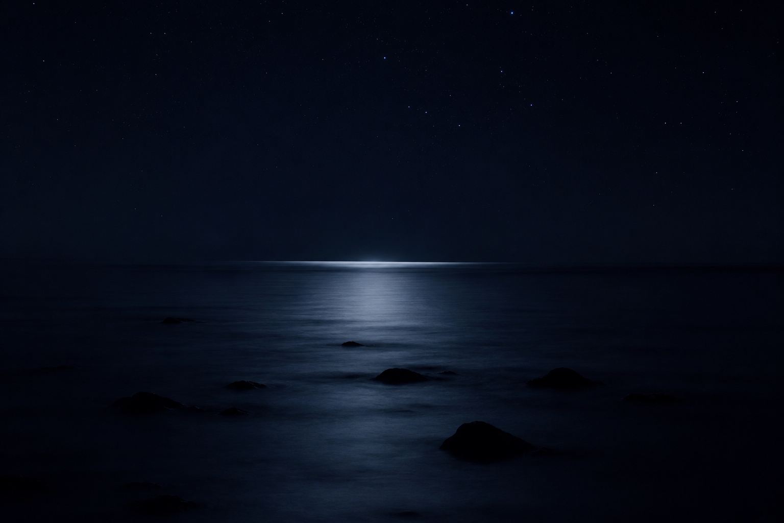 Moonlight over a calm night sea